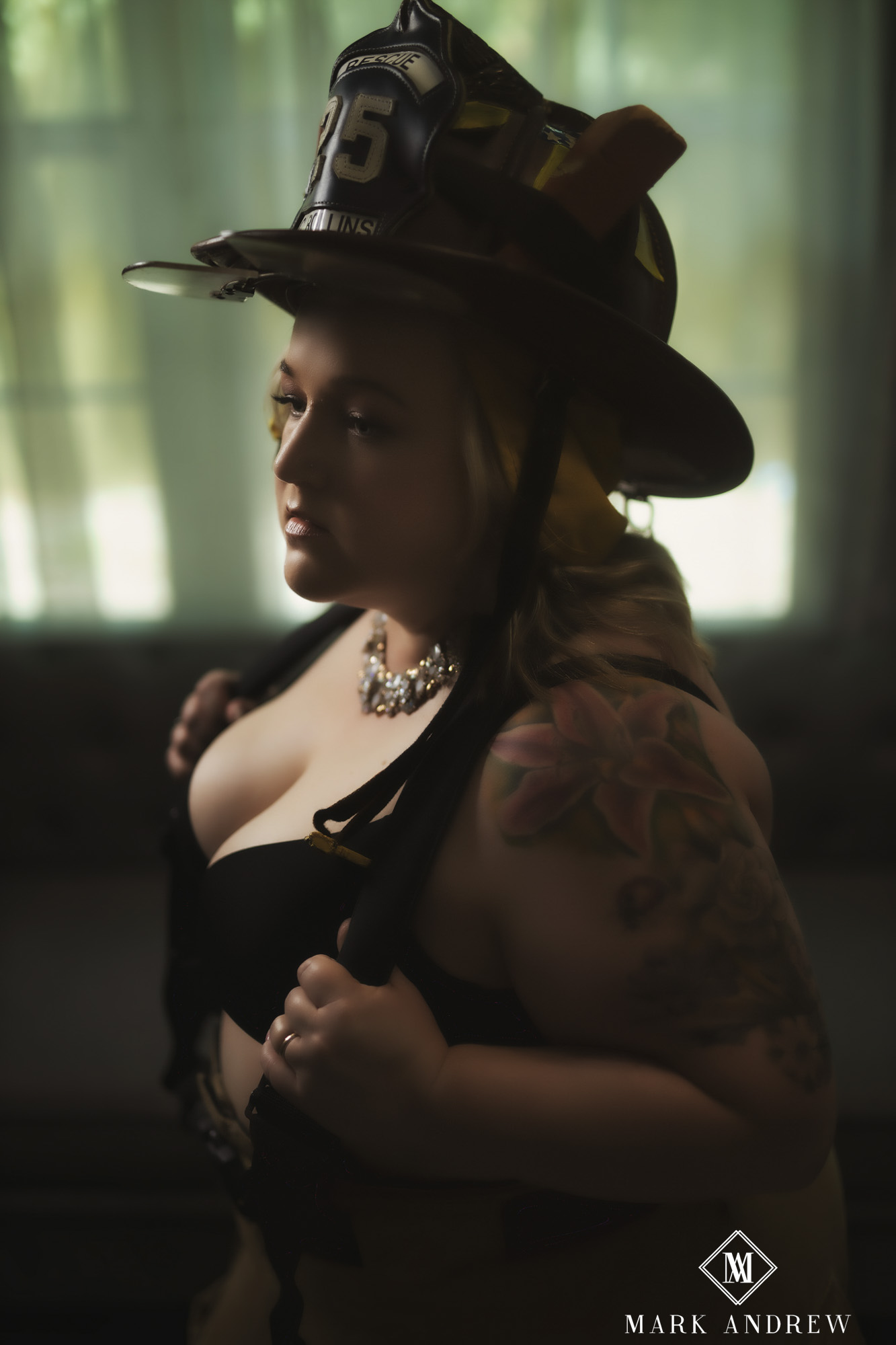 Becky in black lingerie wearing a firefighter helmet — themed personal-prop boudoir session, Elkhart Indiana area