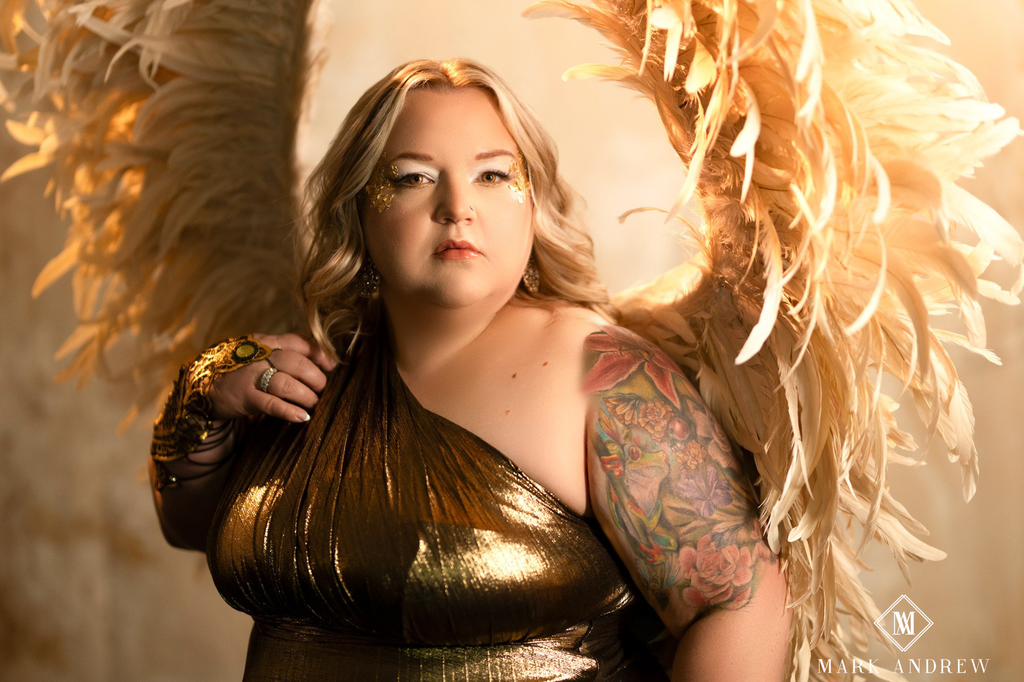 Becky in a draped gold dress with large feather wings — angel queen portrait, themed boudoir session, Granger Indiana studio