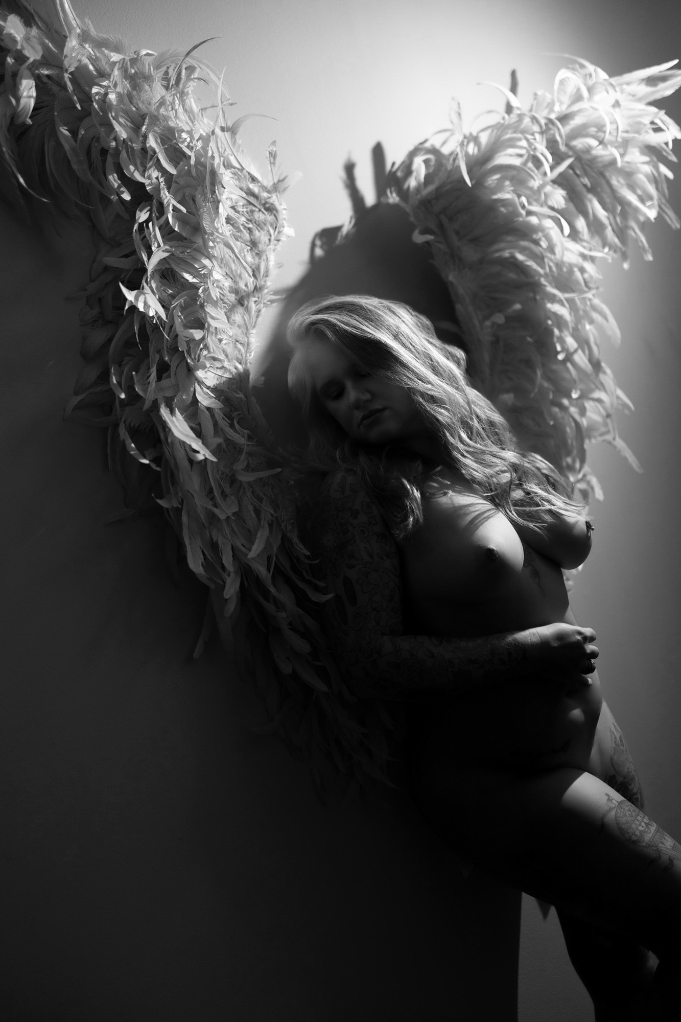 Black and white angel feather wings implied nude boudoir — South Bend