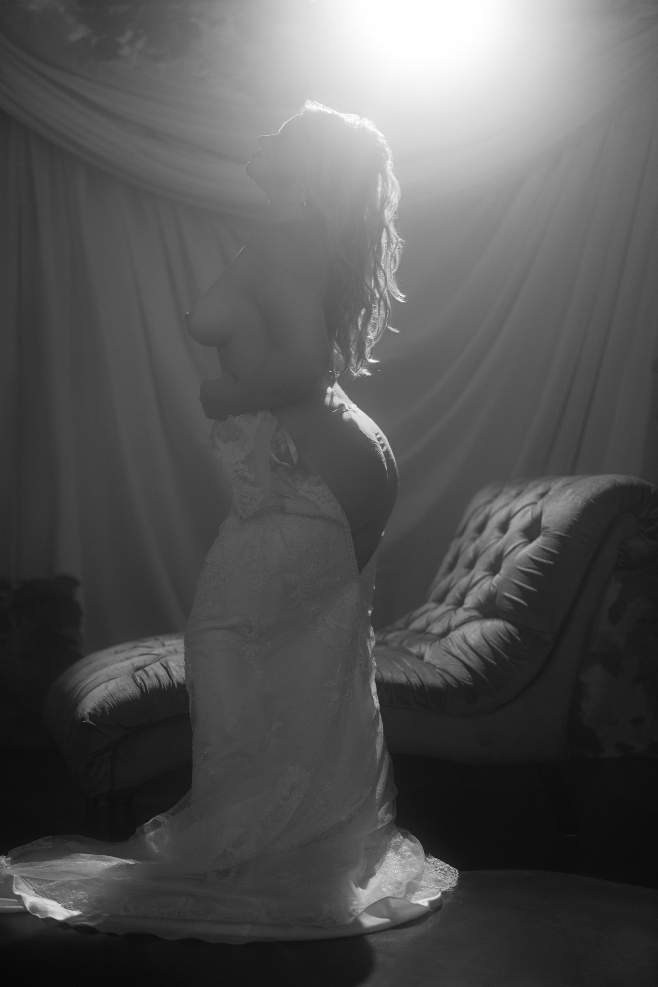 Black and white bridal implied nude in wedding dress, backlit luxury boudoir — South Bend