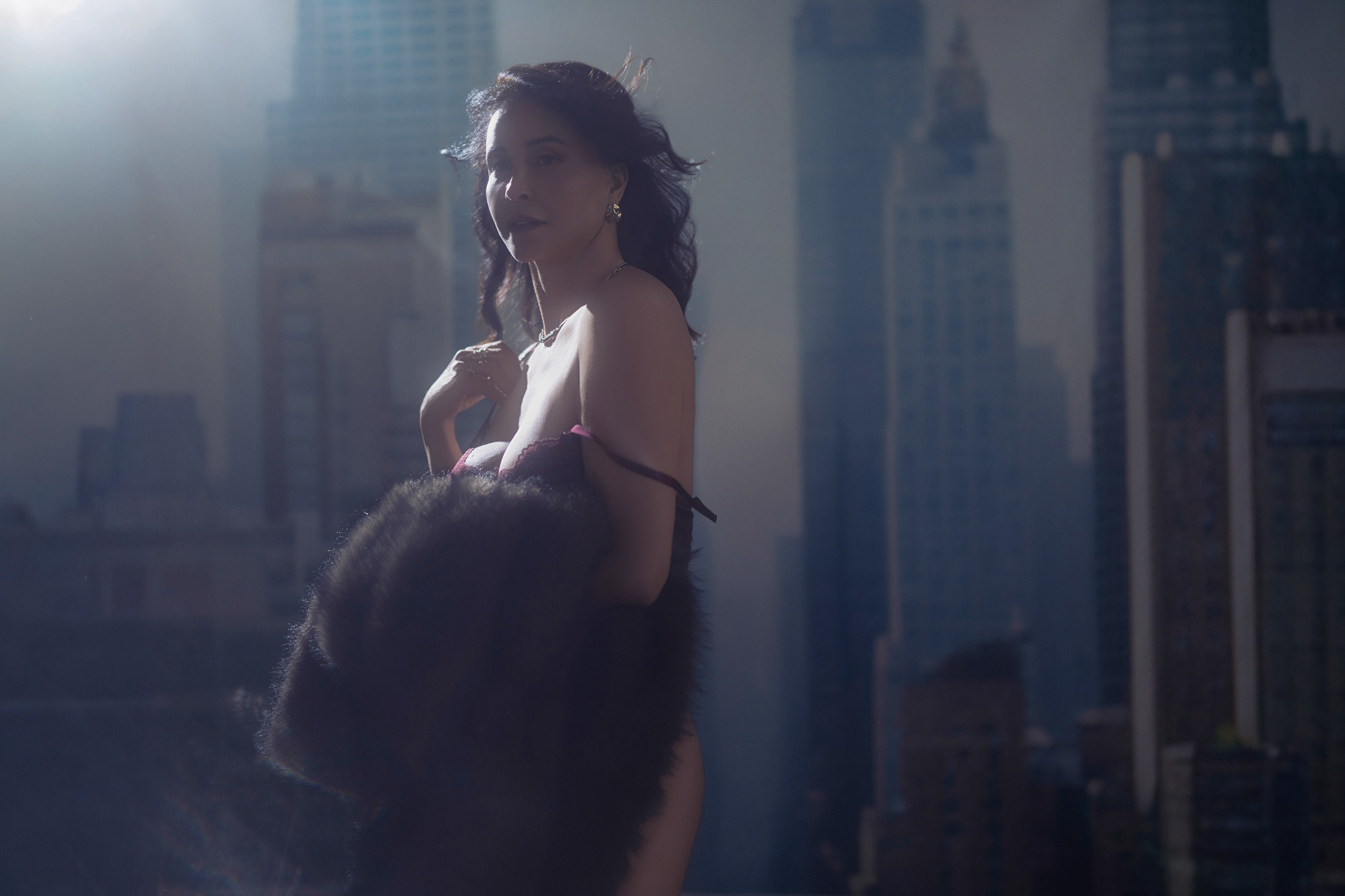 Luxury boudoir portrait — fur coat with city skyline, Mishawaka, Indiana